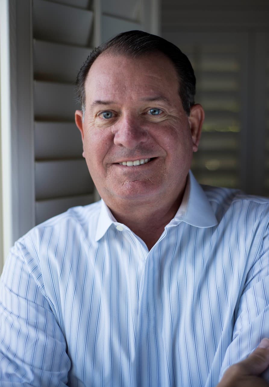 Professional headshot of Dennis "DC" Campbell